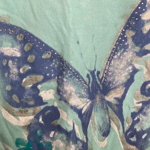 Tee shirt, with rhinestones and glitter design on butterfly print. Light green.